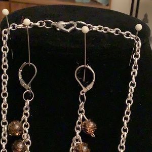Chain is 25 and 1/2 inches long. Not nickel free. The earrings are nickel free.
